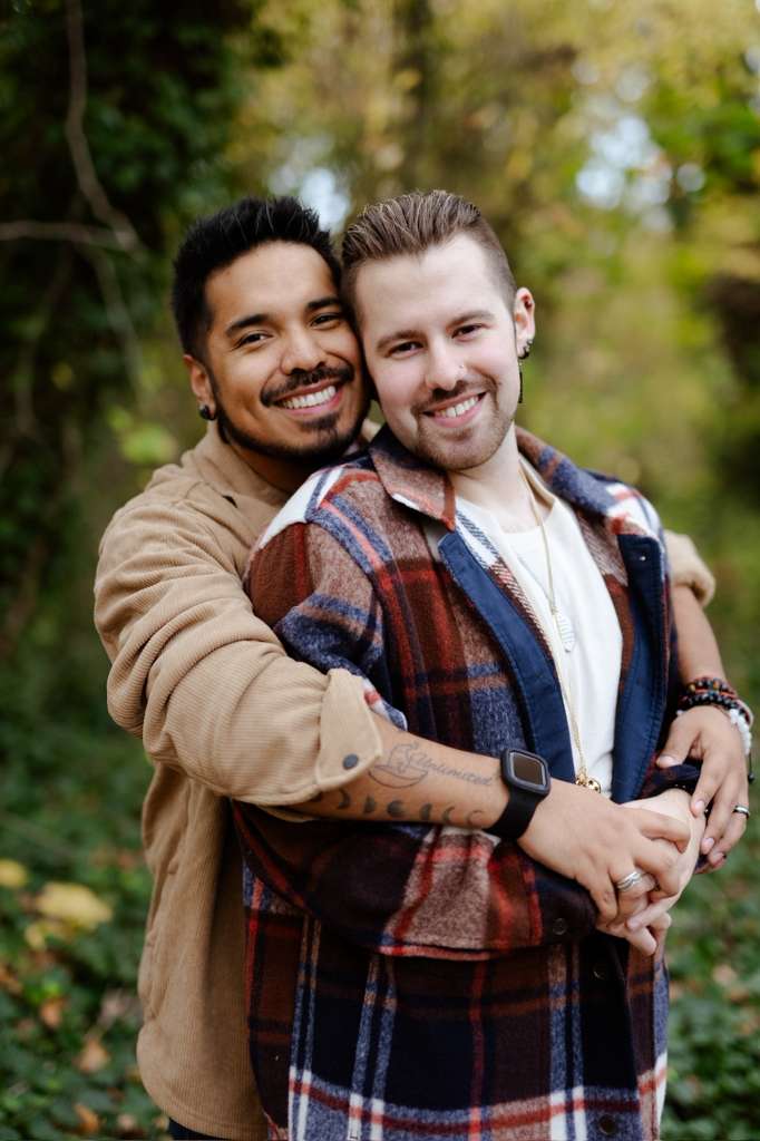Frankie and Rodrigo embracing in the woods