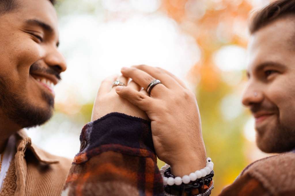 Close-up of hands with engagement rings