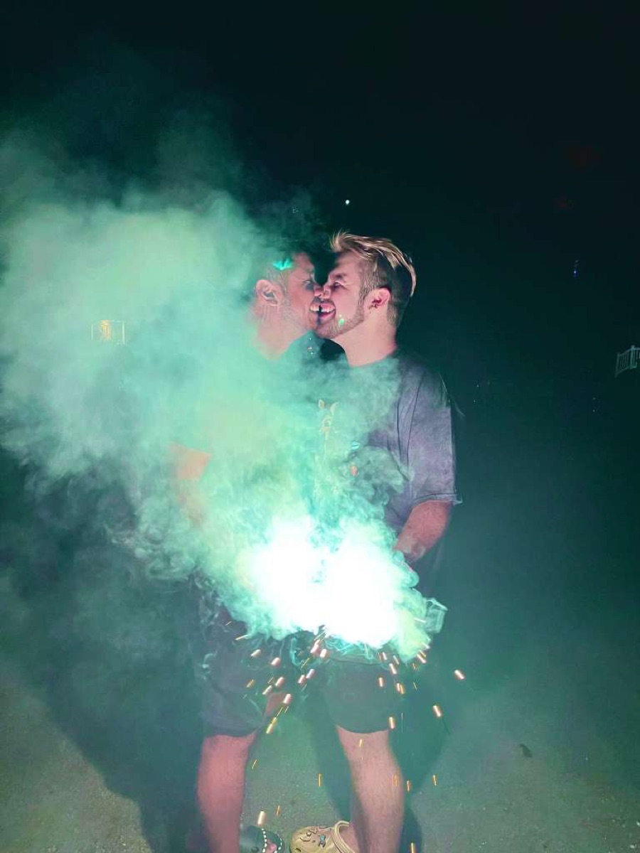Frankie and Rodrigo kissing surrounded by sparklers